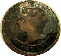 Obverse of the 1887 Canadian One Cent coin showing Queen Victoria's profile, heavily worn and corroded.