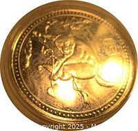 Side of token showing mouse engraving