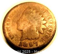 Obverse view of the 1897 Indian Head Cent showing Native American head with feathered headdress and date 1897