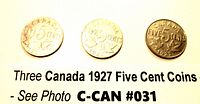 Three 1927 Canadian five cent coins showing reverse side with denomination and maple leaf design, dated 1927.