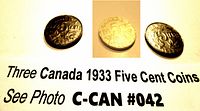 Three Canada 1933 Five Cent Coins viewed from the reverse side showing the denomination and year.