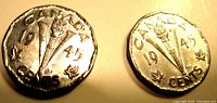 Two Canadian 1945 five cent coins showing the reverse design with the Victory 'V' and torch, dated 1945 with maple leaves at the sides.