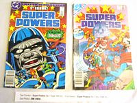 Two comics side by side, Super Powers No. 1 Sept 1985 (first issue) and Super Powers No. 5 Nov 1984, showing front covers.