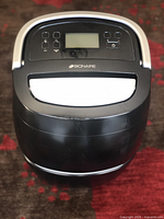 Top view of Bionaire BD205-CN dehumidifier showing control panel with buttons and digital display.