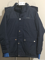 Front view of navy blue winter coat showing snap button closures, chest pocket, and sleeves with blue lining peeking from cuffs.