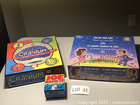 Front view of three board game boxes: Cranium, Men are from Mars, Women are from Venus, and Joe Name It