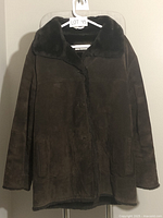 Front view of the Jones New York brown suede leather ladies coat, showing button closure and faux fur collar.