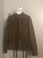 Front view of men's brown suede leather jacket with zipper and stand collar.