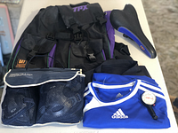 Photo showing bicycle seat, sports backpack, protective gear in black mesh bag, Adidas blue sport t-shirt, and bike tire pressure gauge.