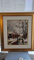 Full view of framed winter street scene painting