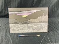 Front view of the Indigenous artist print showing landscape design with hills, trees, and sunset colors.