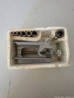 Top view of Stanley No. 59 dowelling jig and burrs in original foam packaging.