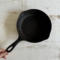 Top view of vintage WagnerWare cast iron skillet showing round cooking surface and handle.