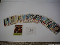 Wide view of approximately 39 NHL hockey cards laid out in a curved arc and spread array, showing front sides with player images and team logos. Cards appear sleeved.