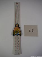 Front view of vintage 1978 Wonder Woman double-sided ruler with numeric increments and Wonder Woman sliding figure centerpiece.