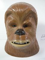 Front view of large molded plastic Chewbacca head playset showing detailed facial features including eyes, nose, and mouth.