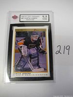 Photo of the graded Curtis Joseph rookie card from 1990-91 OPC Premier series with grade 9.5 NGM visible on label.