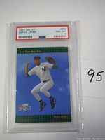1993 Select Derek Jeter rookie card graded PSA 8 in a plastic protective case showing full card front.