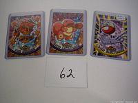 Three early Blue Logo Pokémon cards in protective sleeves: Dodrio #85, Lickitung #108, Electrode #101, front view.