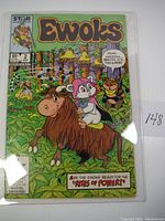 Front cover of Ewoks #2 comic book showing Ewok characters in a forest scene, in protective plastic sleeve.