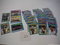Spread of multiple 1979 O-Pee-Chee hockey cards laid out showing player portrait cards and team cards with distinctive colorful borders.