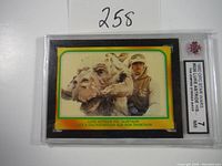 Front of 1980 Topps Star Wars Empire Strikes Back trading card featuring Luke riding Tauntaun, in PSA slab graded 7