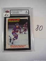 Front view of the 1978-79 O-Pee-Chee Mike Bossy #1 rookie hockey card showing player image and rookie highlights text.