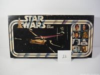 Front of the box showing Star Wars logo, spaceship artwork, and numbered tag for lot.