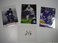 Four hockey cards displayed on white background, showing players from Toronto Maple Leafs.