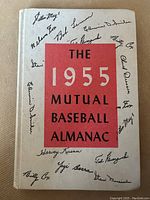 Front cover of the 1955 Mutual Baseball Almanac showing title and facsimile signatures of baseball players.