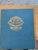 Front cover of the hardcover historical atlas showing the embossed gold title text 'Historical Atlas of York County Ontario Illustrated Miles & Co. 1878' on dark blue cloth.