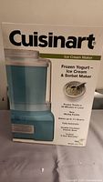 Photo of the Cuisinart ice cream maker box showing the product image and key features, including frozen treats in 20 minutes, maximum paddle, fully automatic, and 3-year warranty.