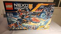 Front view of LEGO NEXO Knights set box 70351 showing artwork of Clay's Falcon Fighter Blaster in battle action with fantasy characters and branding.