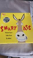 Smart Ass board game new edition box with cartoon donkey face and bright yellow background