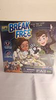 Front of the Spy Code Break Free board game box showing colorful illustrations of spies and the game title.