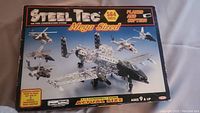 Front of Steel Tec Mega Sized construction set box showing plane and copter models and part count of 564