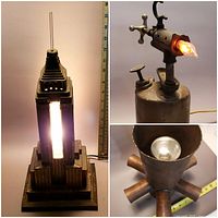 Three lamps shown: Empire State Building lamp lit with ruler beside for size reference, welding torch lamp showing flame-shaped bulb lit, and brass ceiling mount lamp from above revealing bulb inside