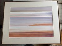 Frontal view of “April View” pastel print showing horizontal bands of pink, blue and neutral tones in rose gold tone metal frame