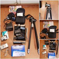 Overview photo showing all cameras, boxed Olympus FE-230, accessories including flashes, cases, cables, and the tripod.