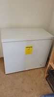 Front view of the white chest freezer showing overall condition