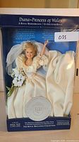 Front view of the Princess Diana doll in bridal gown and original packaging labeled Royal Britannia Collection.