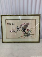 Front view of framed Asian style bird and flower print artwork