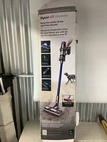 Full box of Dyson V11 Absolute vacuum parts showing front packaging with model and features.