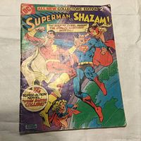 Comic book cover showing Superman and Shazam fighting, highlighting title, price and artwork