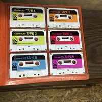 Six cassettes labeled Games 20 Tape 1 to Tape 6 in an orange binder.