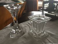 Photo of heavy crystal square candle holder on a table.