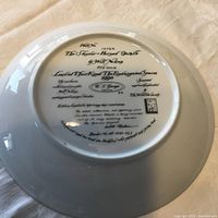 Back of the plate showing detailed printed information on the series, artist, production year (1990), and limited edition number.