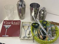 Overall lot with shakers, mixing glass, book, wine markers, basket with tools