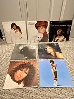 All seven Barbra Streisand album covers laid out on floor