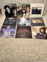 Front view of all nine LP album covers arranged in three rows